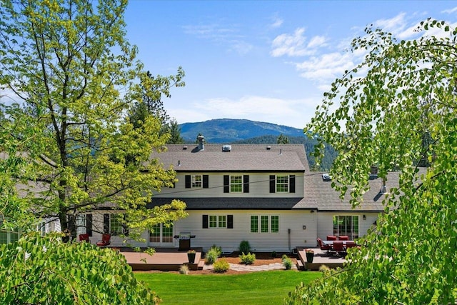 6814 S Jackson Ridge Ln, Greenacres, WA 99016 - back of property with a patio area, a yard, and a deck with mountain view