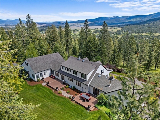 6814 S Jackson Ridge Ln, Greenacres, WA 99016 - aerial view of property and surrounding area with a mountainous background and a heavily wooded area