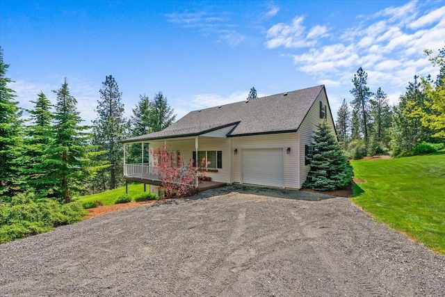 6814 S Jackson Ridge Ln, Greenacres, WA 99016 - view of front of house featuring an attached garage, driveway, a front lawn, covered porch, and roof with shingles