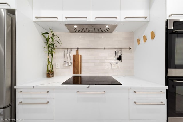 27809 N Bruce Rd, Chattaroy, WA 99003 - kitchen featuring white cabinets, wall chimney exhaust hood, appliances with stainless steel finishes, and tasteful backsplash