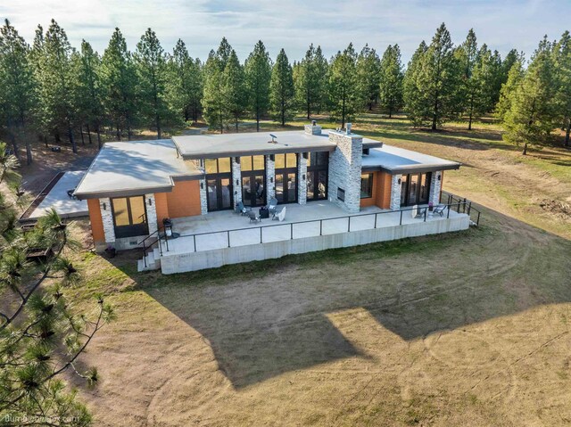 27809 N Bruce Rd, Chattaroy, WA 99003 - rear view of house with a patio