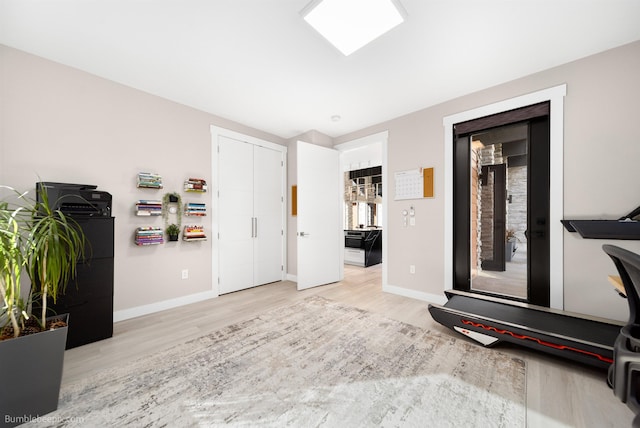 27809 N Bruce Rd, Chattaroy, WA 99003 - workout room featuring baseboards and light wood-type flooring