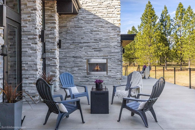 27809 N Bruce Rd, Chattaroy, WA 99003 - view of patio / terrace with an outdoor stone fireplace