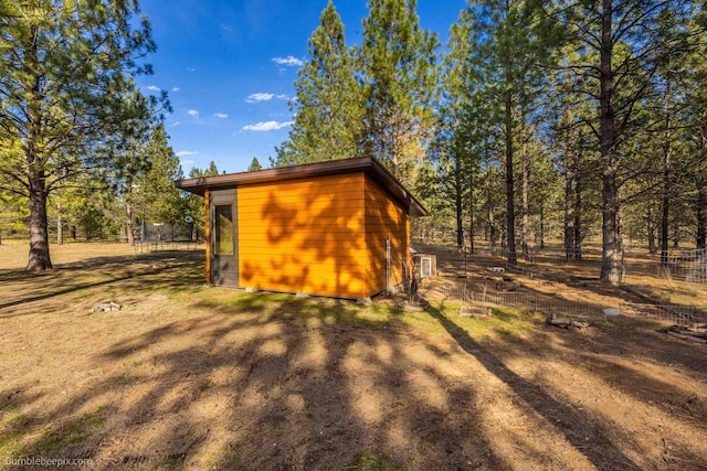 27809 N Bruce Rd, Chattaroy, WA 99003 - view of outdoor structure with a trampoline, an outbuilding, and fence
