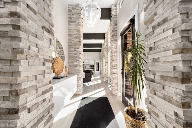 27809 N Bruce Rd, Chattaroy, WA 99003 - hallway featuring a towering ceiling and wood finished floors
