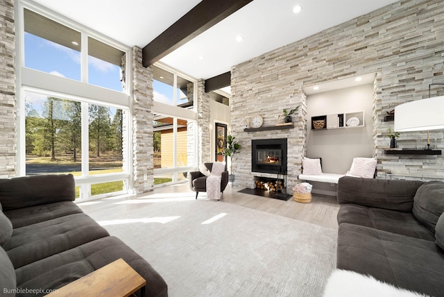 27809 N Bruce Rd, Chattaroy, WA 99003 - living area with recessed lighting, a high ceiling, beam ceiling, a fireplace, and wood finished floors