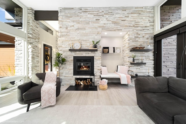 27809 N Bruce Rd, Chattaroy, WA 99003 - living room featuring a stone fireplace and wood finished floors