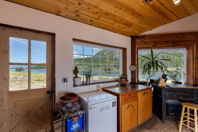4004P N Northport Flat Creek Rd, Northport, WA 99157 - kitchen with a water view, dark countertops, vaulted ceiling, wooden ceiling, and white fridge