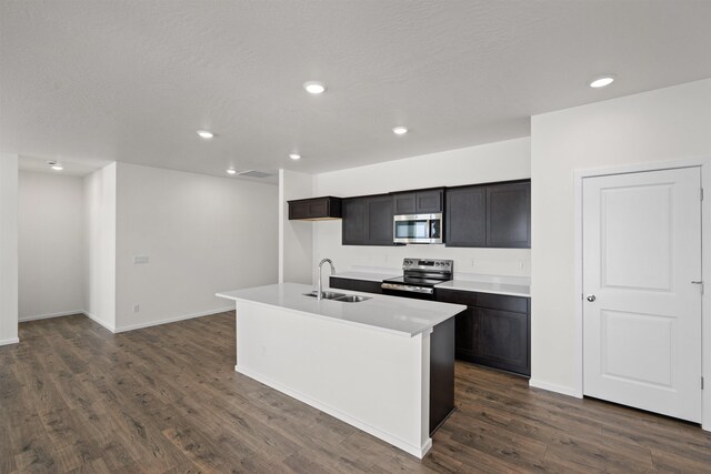 805 E 5th St, Deer Park, WA 99006 - kitchen with dark wood-style floors, a sink, stainless steel appliances, and recessed lighting
