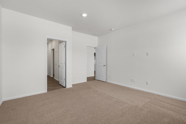 805 E 5th St, Deer Park, WA 99006 - unfurnished room with light carpet, baseboards, and recessed lighting
