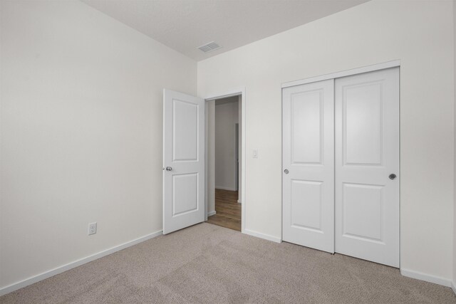 805 E 5th St, Deer Park, WA 99006 - unfurnished bedroom featuring carpet floors, a closet, baseboards, and visible vents