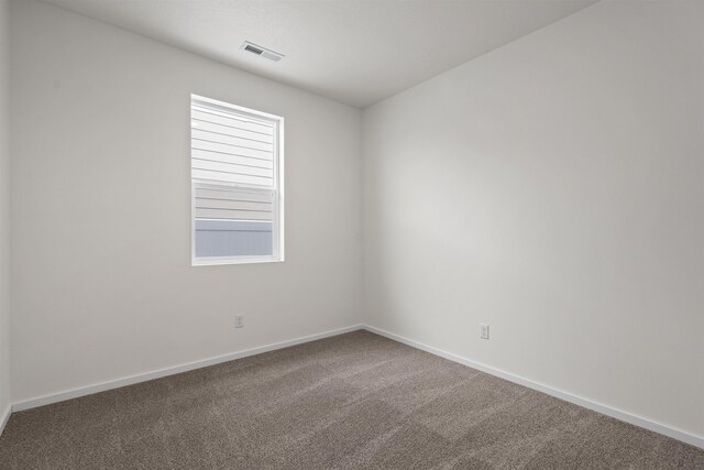 805 E 5th St, Deer Park, WA 99006 - spare room featuring carpet, baseboards, and visible vents