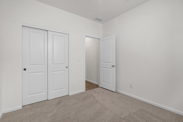 805 E 5th St, Deer Park, WA 99006 - unfurnished bedroom with baseboards, visible vents, a closet, and carpet floors