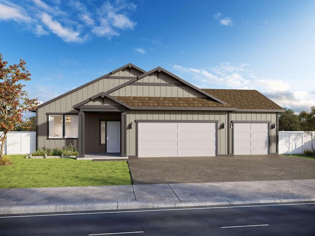 805 E 5th St, Deer Park, WA 99006 - view of front of property featuring driveway, fence, a front lawn, a shingled roof, and a garage