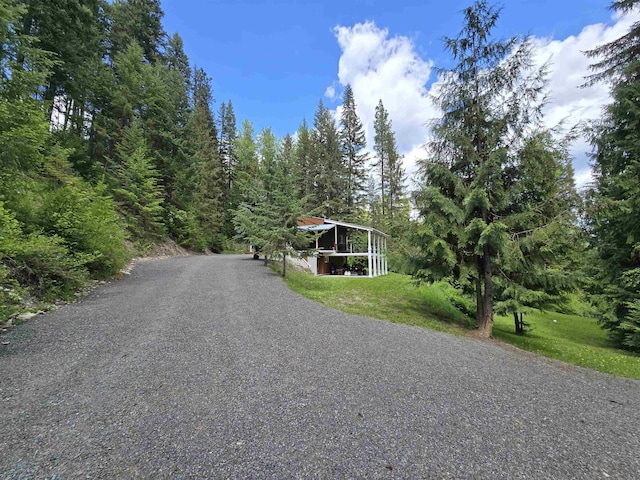 604 Deadman Creek Rd, Kettle Falls, WA 99141 - view of asphalt road with a wooded view