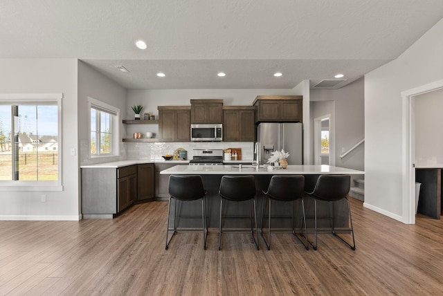 dining area featuring recessed lighting, wood finished floors, a chandelier, and vaulted ceiling