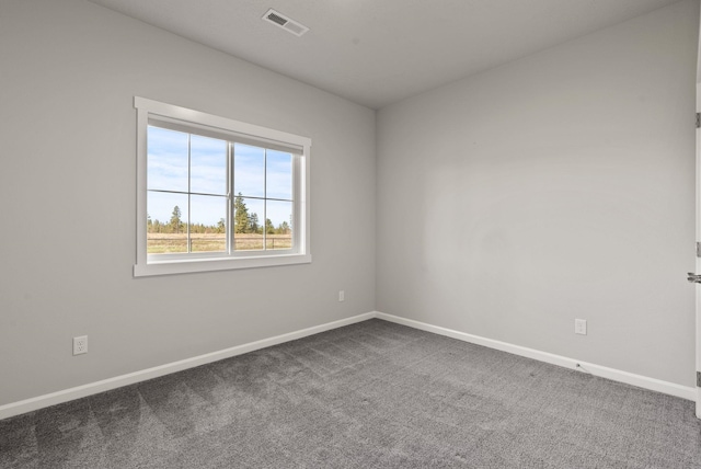 carpeted bedroom featuring baseboards and visible vents