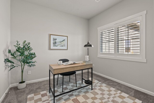 office area with light colored carpet and baseboards