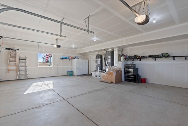 garage featuring strapped water heater, freestanding refrigerator, and a garage door opener
