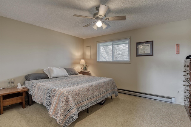 4718 N Campbell Rd, Otis Orchards, WA 99027 - bedroom featuring a baseboard heating unit, carpet floors, a textured ceiling, and ceiling fan