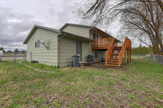 4718 N Campbell Rd, Otis Orchards, WA 99027 - rear view of house with stairs, a wooden deck, and a gate