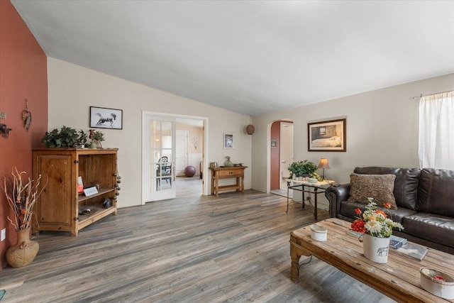 1810 W Paradise Rd, Spokane, WA 99224 - living room featuring arched walkways, wood finished floors, and lofted ceiling