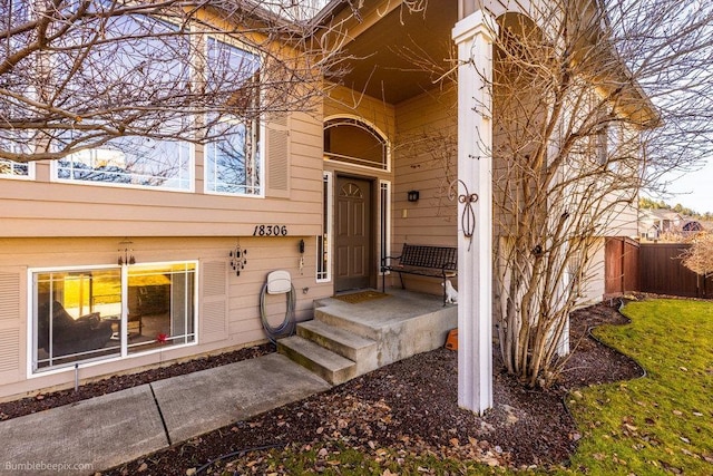 doorway to property with fence