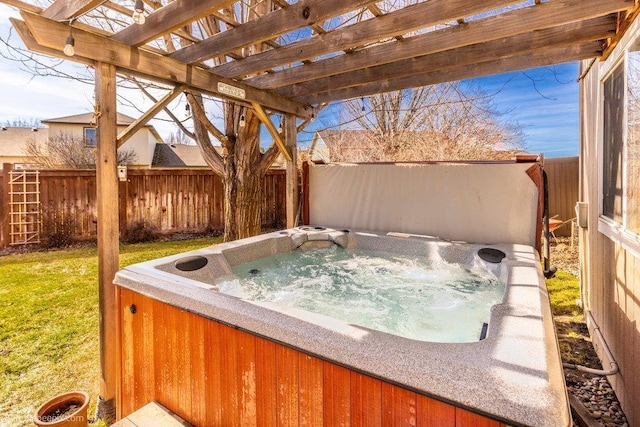 view of patio / terrace featuring a hot tub and a fenced backyard