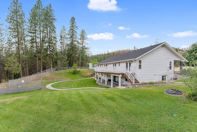 14505 W Coulee Hite Rd, Spokane, WA 99224 - rear view of property featuring stairs, a patio area, an outdoor fire pit, a deck, and a lawn