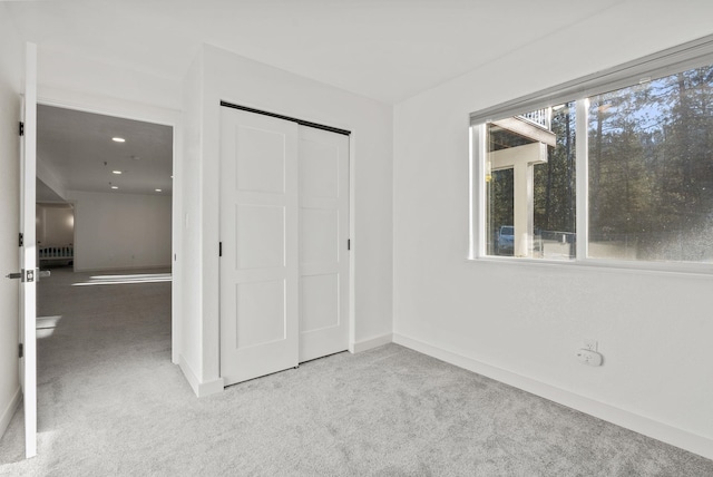 14505 W Coulee Hite Rd, Spokane, WA 99224 - unfurnished bedroom with baseboards, a closet, and carpet floors