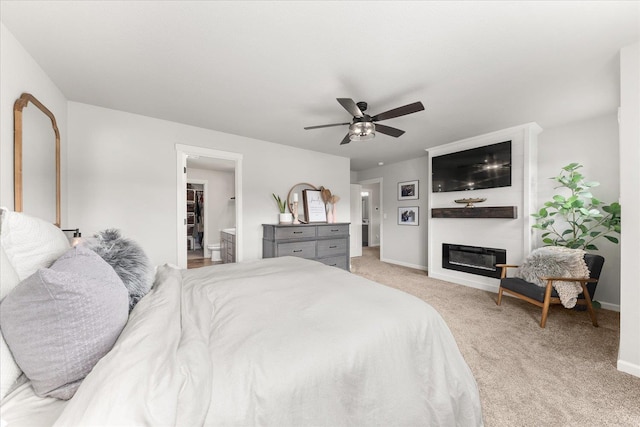 9018 W 72nd Ave, Cheney, WA 99004 - bedroom featuring light colored carpet, a fireplace, baseboards, and a ceiling fan