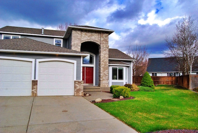 612 N Madson Ct, Liberty Lake, WA 99019 - view of front of property with roof with shingles, fence, an attached garage, driveway, and a front yard