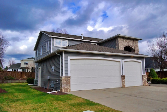 612 N Madson Ct, Liberty Lake, WA 99019 - view of home's exterior featuring central air condition unit, fence, an attached garage, concrete driveway, and a yard