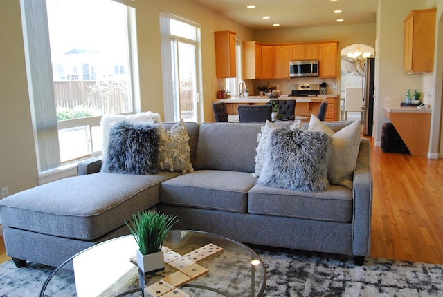 612 N Madson Ct, Liberty Lake, WA 99019 - living room featuring a notable chandelier, recessed lighting, and light wood-type flooring