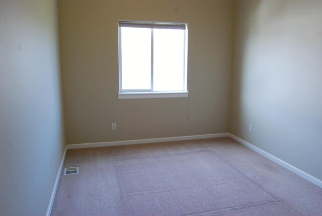 612 N Madson Ct, Liberty Lake, WA 99019 - unfurnished room with baseboards, visible vents, and carpet floors
