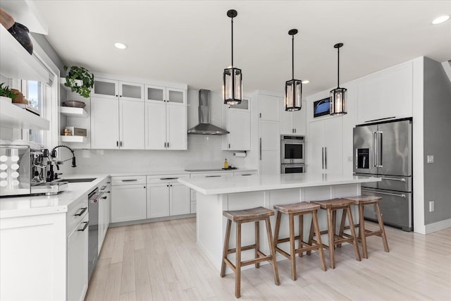 16215 W Coulee Hite Rd, Spokane, WA 99224 - kitchen with stainless steel appliances, wall chimney range hood, a sink, open shelves, and a center island
