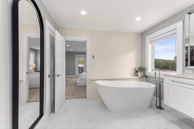 16215 W Coulee Hite Rd, Spokane, WA 99224 - bathroom with connected bathroom, a soaking tub, recessed lighting, marble finish flooring, and vanity