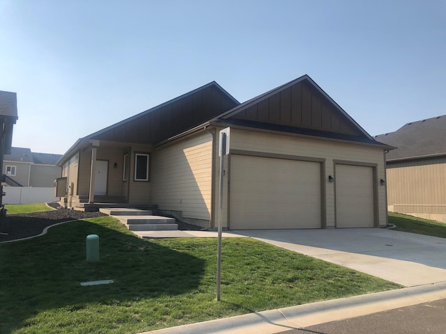 single story home with a front yard, an attached garage, board and batten siding, and concrete driveway