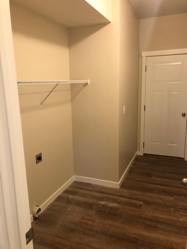 laundry area with baseboards, dark wood-style flooring, laundry area, and hookup for an electric dryer