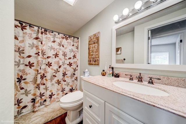 14825 E Mission Avenue 14827E Mission Ave, Spokane Valley, WA 99216 - full bathroom featuring a textured ceiling, toilet, a shower with shower curtain, and vanity