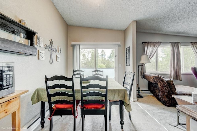 14825 E Mission Avenue 14827E Mission Ave, Spokane Valley, WA 99216 - dining area featuring light colored carpet, a baseboard heating unit, and a textured ceiling