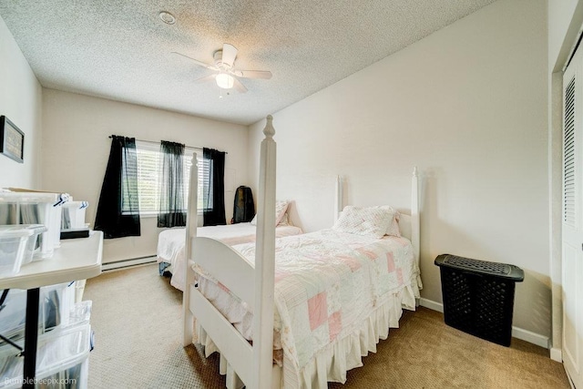 14825 E Mission Avenue 14827E Mission Ave, Spokane Valley, WA 99216 - bedroom with a baseboard heating unit, carpet, baseboards, a textured ceiling, and ceiling fan