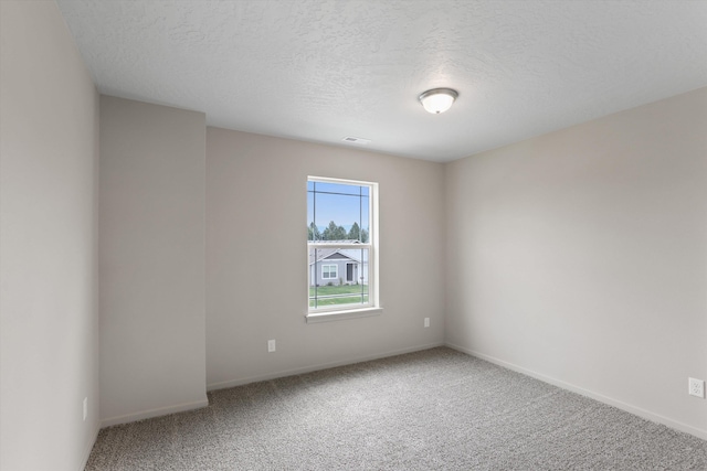 503 N Arc Ct, Spokane Valley, WA 99016 - carpeted spare room featuring baseboards and a textured ceiling