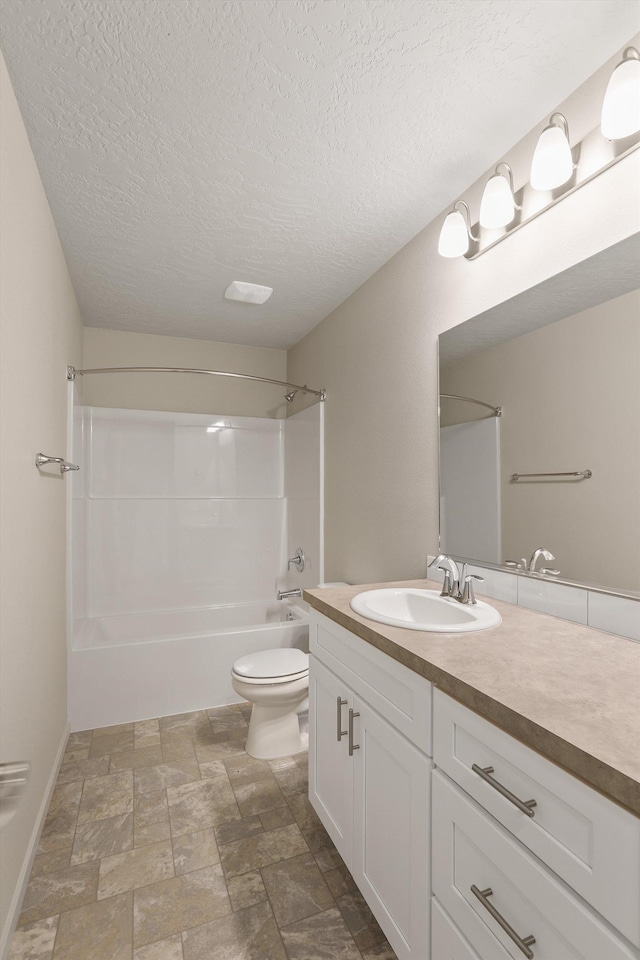 503 N Arc Ct, Spokane Valley, WA 99016 - full bath with vanity, shower / washtub combination, stone finish floors, and a textured ceiling