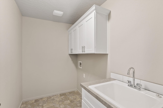 503 N Arc Ct, Spokane Valley, WA 99016 - laundry area with stone finish flooring, cabinet space, and hookup for a washing machine