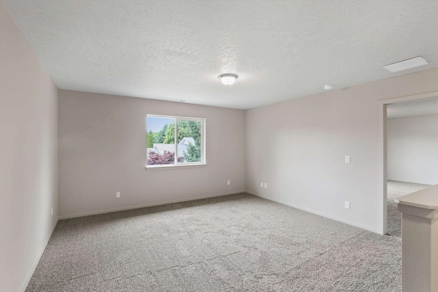 503 N Arc Ct, Spokane Valley, WA 99016 - unfurnished room featuring carpet floors and a textured ceiling