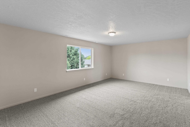 503 N Arc Ct, Spokane Valley, WA 99016 - empty room featuring carpet floors and a textured ceiling