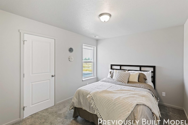 509 N Arc Ct, Spokane Valley, WA 99016 - bedroom with baseboards, carpet flooring, and a textured ceiling