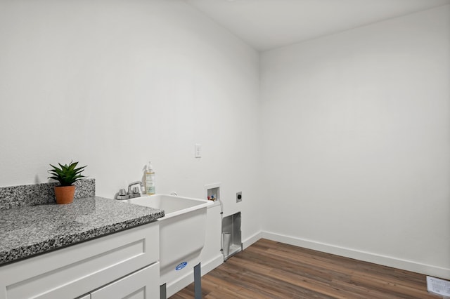 washroom with dark wood-style flooring, hookup for a washing machine, baseboards, laundry area, and electric dryer hookup
