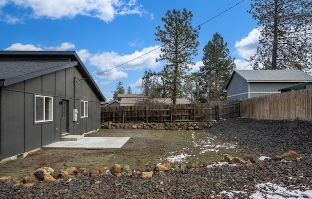 view of yard with a fenced backyard and a patio